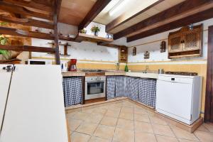 A kitchen or kitchenette at Villa Can Pujadas by Slow Villas