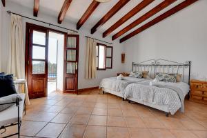 A bed or beds in a room at Villa Can Pujadas by Slow Villas