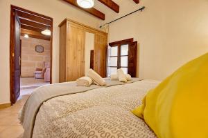 A bed or beds in a room at Villa Can Pujadas by Slow Villas