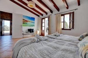 A bed or beds in a room at Villa Can Pujadas by Slow Villas