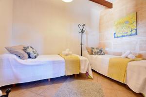 A bed or beds in a room at Villa Can Pujadas by Slow Villas