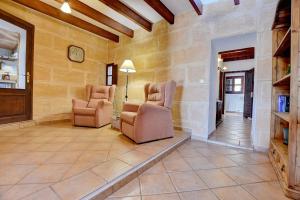 A seating area at Villa Can Pujadas by Slow Villas