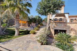 A garden outside Villa Can Pujadas by Slow Villas