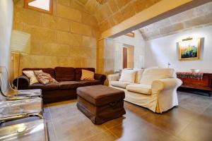 a living room with two couches and a table at Amilcar House by Slow Villas in Palma de Mallorca