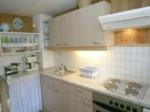 a kitchen with a sink and a counter top at Chalet in caroles with a nearby forest in Karrösten