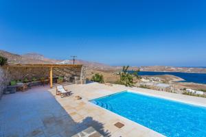 a swimming pool with a view of the water at Spacious 6 bdrm Stone Villa with Pool in Rámos