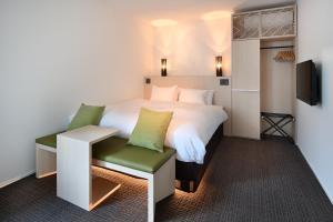 Postel nebo postele na pokoji v ubytování HOTEL KYOTOLOGY