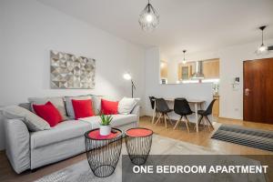 a living room with a couch and a table at BpR City Lodge Apartments in Budapest