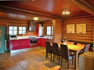 a kitchen and dining room with a table and chairs at Cosy chalet in Tyrol with a private garden in Hopfgarten im Brixental