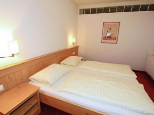 Łóżko lub łóżka w pokoju w obiekcie Apartment Stumm near Zillertal Ski Slopes