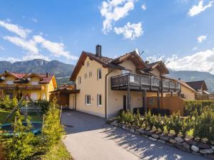 a large house with a balcony on the side of it at Chalet in Carinthia near ski area in Kötschach