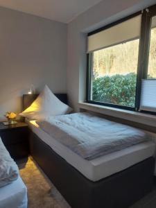 Postel nebo postele na pokoji v ubytování Ferienwohnung Haus Ilse
