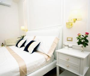 A bed or beds in a room at Viale Italia Boutique Rooms
