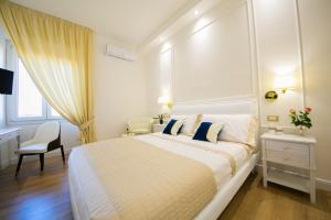 A bed or beds in a room at Viale Italia Boutique Rooms