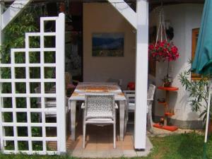 a table and chairs sitting on a patio at Apartment in Wernberg in Carinthia with pool in Wernberg