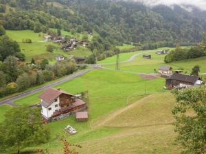 an aerial view of a small village in a green field at Cozy Apartment near Ski Area in Tschagguns in Schruns