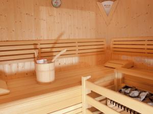 a wooden sauna with a bucket in the middle at Apartment in Mittersill near the ski area in Mittersill