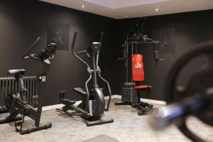 a gym with several exercise bikes in a room at JustStay Ratingen in Ratingen