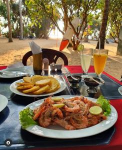 
a plate of food on a table at Lavila beach resort in Wadduwa
