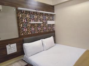 Ένα ή περισσότερα κρεβάτια σε δωμάτιο στο Soni Punjab Guest House