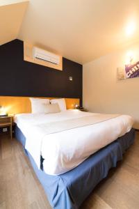 Postel nebo postele na pokoji v ubytování Auberge de Poteaupré