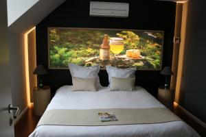 Postel nebo postele na pokoji v ubytování Auberge de Poteaupré
