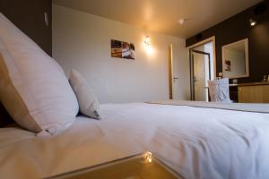 Postel nebo postele na pokoji v ubytování Auberge de Poteaupré