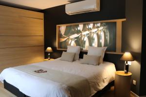 Postel nebo postele na pokoji v ubytování Auberge de Poteaupré