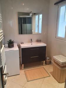 a bathroom with a sink and a mirror at L'ESTRAN in Saint-Valery-sur-Somme +27 photos