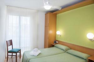 Postel nebo postele na pokoji v ubytování Apartaments Costa d'Or