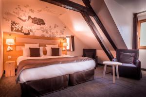 Postel nebo postele na pokoji v ubytování Le Grand Aigle Hotel & Spa****