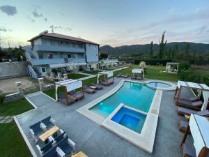 an aerial view of a house with a swimming pool at A Ponte Studios & Apartments in Sykia Chalkidikis