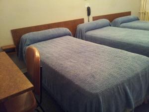 Postel nebo postele na pokoji v ubytování Hôtel Sampiero Corso