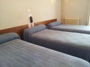 Postel nebo postele na pokoji v ubytování Hôtel Sampiero Corso