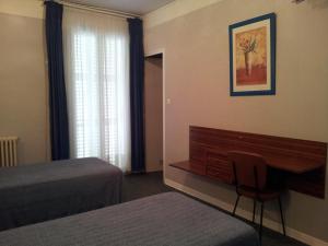 Postel nebo postele na pokoji v ubytování Hôtel Sampiero Corso
