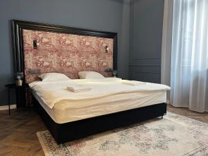 Posteľ alebo postele v izbe v ubytovaní Hotel Rumor