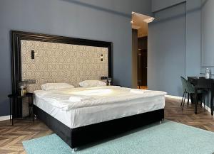 Posteľ alebo postele v izbe v ubytovaní Hotel Rumor
