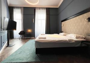 Posteľ alebo postele v izbe v ubytovaní Hotel Rumor