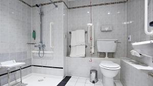 a bathroom with a shower and a toilet and a sink at Holiday Inn Express Liverpool-Albert Dock, an IHG Hotel in Liverpool