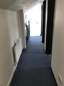a hallway with a door leading into a room at Finn McCools Giants Causeway Hostel in Bushmills