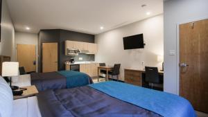 Un pat sau paturi într-o cameră la Motel L'Abri