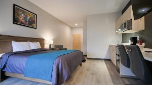 Un pat sau paturi într-o cameră la Motel L'Abri
