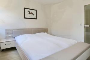Ein Bett oder Betten in einem Zimmer der Unterkunft Hanse-Haus Wohnung 04