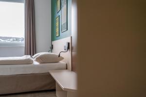 Ліжко або ліжка в номері SLEEEP HOTEL Ansfelden