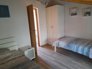 Postel nebo postele na pokoji v ubytování Apartman Jurišić