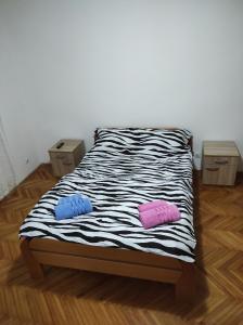 two pillows on a bed in a room at Fortuna in Vrdnik