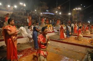 a group of people performing in a show in front of a crowd at Hotel Varanasi Heritage in Varanasi