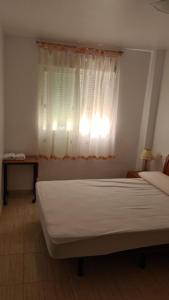 Postel nebo postele na pokoji v ubytování Acogedor apartamento 2ª Línea playa