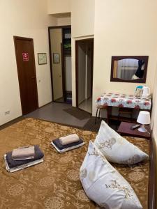 a bedroom with a bed and a chair at Hotel Safyan in Kazan