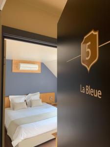 Postel nebo postele na pokoji v ubytování Auberge de Poteaupré